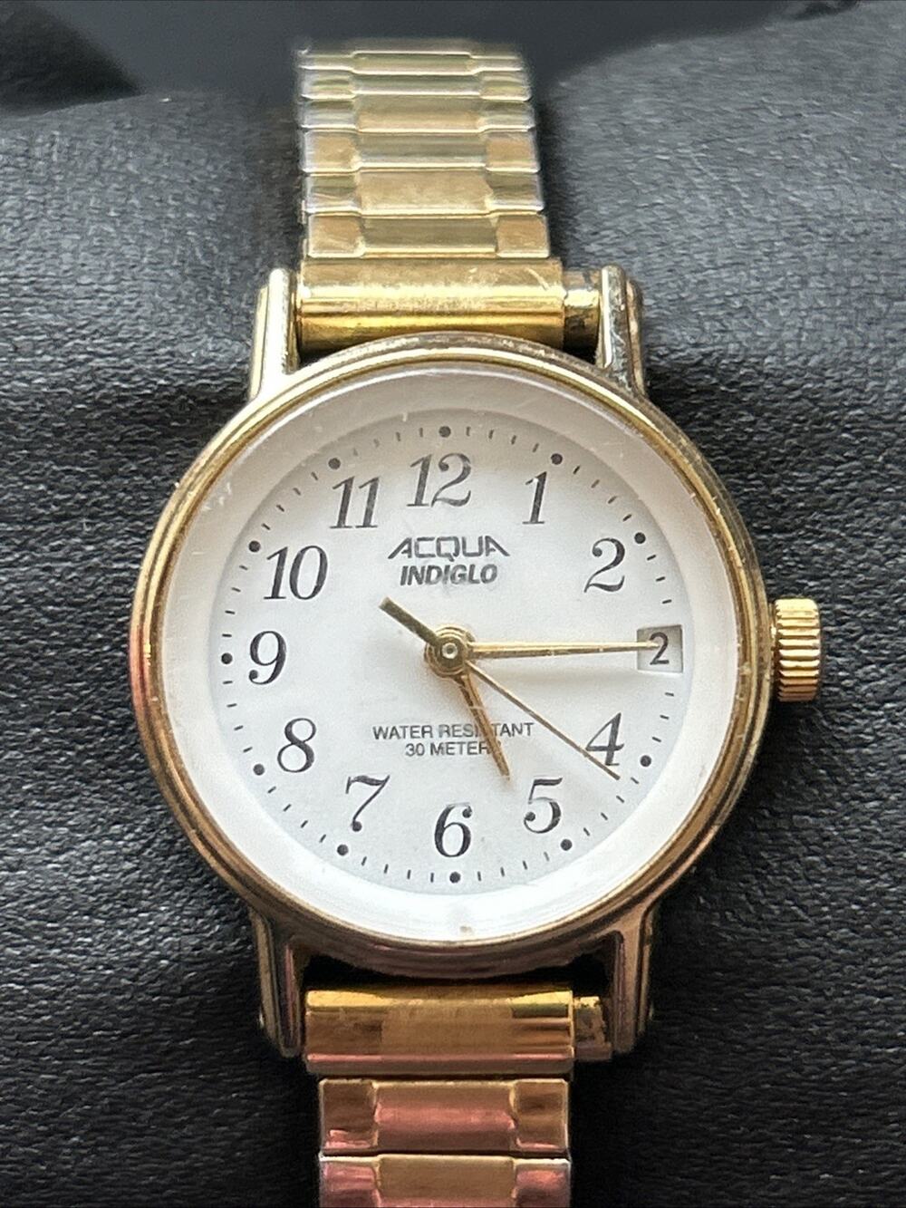 Acqua Indiglo Gold Tone White Dial Women’s Stretch Band Quartz Watch
